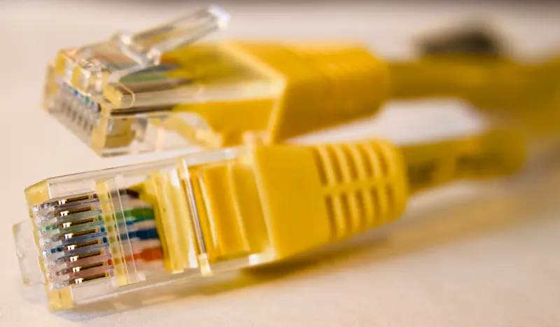 Business owner reviewing a bandwidth planning worksheet beside a network switch