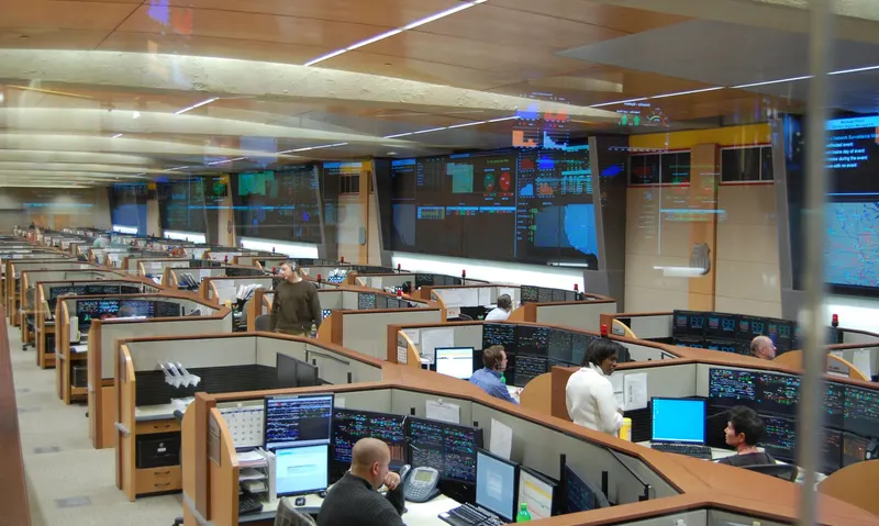 Operators watching fleet activity on a dispatch console