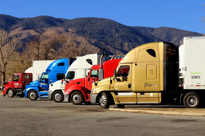 Semi trucks backed into loading docks at a distribution warehouse