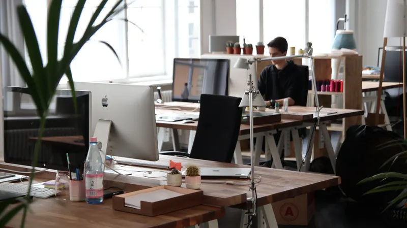 A wide, open workspace shared by several kinds of business