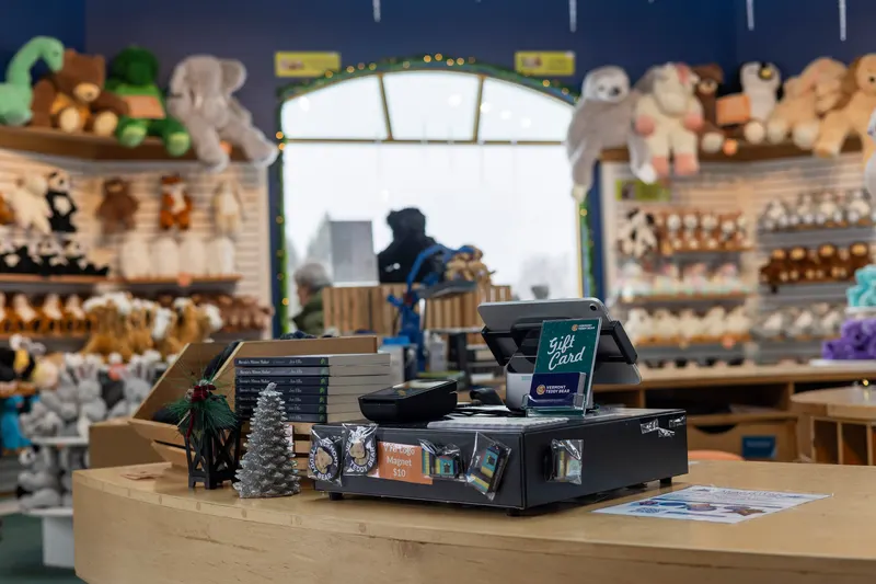 Cashier taking a card payment at a boutique checkout counter